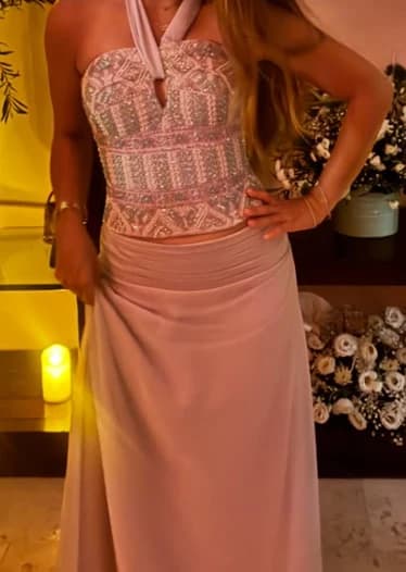 Blush halter top densely beaded with pearls, with a pleated chiffon skirt, candlelit room